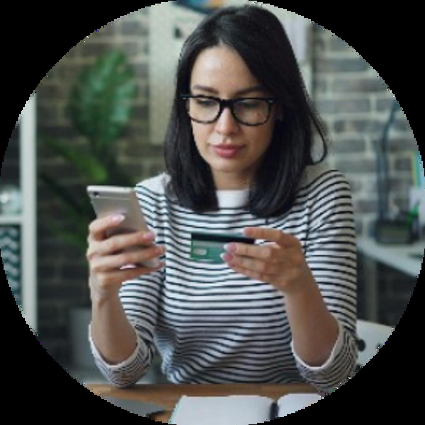 Woman holding phone and credit card